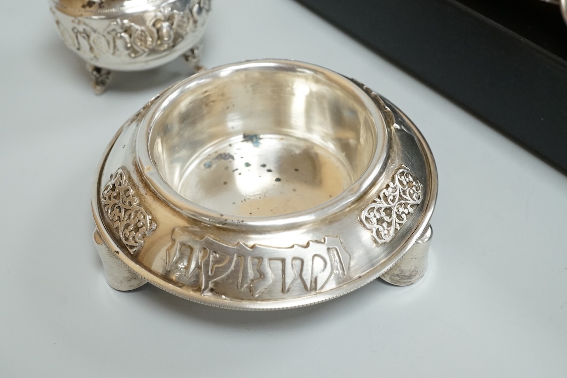 A small group of assorted continental 925 and other white metal items including a Judaic scroll holder, a Torah pointer?(lacking pointer), an Israeli ashtray, three Judaic match sleeves, two 925 handled servers and an Ir